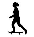 Young girl rides on skateboard.