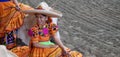 Female rider in orange dress with flowers