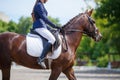 Young girl riding horse on equestrian competition Royalty Free Stock Photo