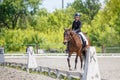 Young girl riding horse on equestrian competition Royalty Free Stock Photo