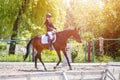 Young girl riding horse on equestrian competition Royalty Free Stock Photo