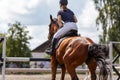 Young girl riding horse on equestrian sport show Royalty Free Stock Photo