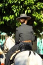 Young girl riding at horse in the Seville Fair, feast in Spain Royalty Free Stock Photo
