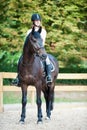 Young girl riding horseback at early morning in sunlight Royalty Free Stock Photo