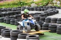 Young girl riding a quad bike around a track