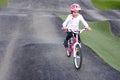 Young Girl Rids Bicycle on Obstacle Trek