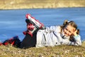 Young girl in roller skates lays on the ground