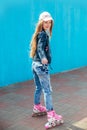 Young girl on rollerblades in the city Royalty Free Stock Photo