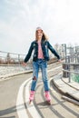 Young girl on rollerblades in the city Royalty Free Stock Photo