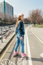 Young girl on rollerblades in the city Royalty Free Stock Photo