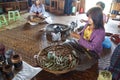 Young girl rolling cheroot cigars