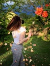 Young girl in the rose garden