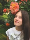 Young girl in the rose garden