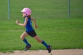 Young Girl Running Bases in Softball Royalty Free Stock Photo