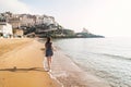 Young girl running on the beach of Sperlonga, Italy Royalty Free Stock Photo