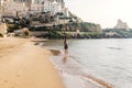 Young girl running on the beach of Sperlonga, Italy Royalty Free Stock Photo