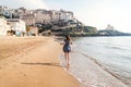 Young girl running on the beach of Sperlonga, Italy Royalty Free Stock Photo