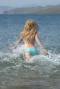 Young Girl Running to the Water Royalty Free Stock Photo