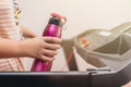 Young girl running on the treadmill with a sports water bottle in hand Royalty Free Stock Photo