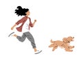 A young girl runs with a spaniel dog