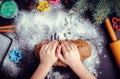 Young girl`s hands kneading dough