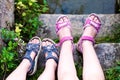 Young girl`s legs with sandals Royalty Free Stock Photo