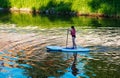 A young girl is sailing in a canoe on the Nitra river