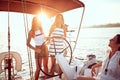 Young girl sailing on the luxury boat together and enjoy at sunset Royalty Free Stock Photo