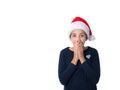 Young girl with Santa hat looking surprised Royalty Free Stock Photo