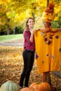 Young girl with a scarecrow Royalty Free Stock Photo