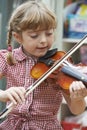 Young Girl At School Learning To Play Violin Royalty Free Stock Photo