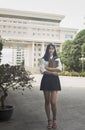 A young girl in a school uniform