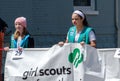 Young girl scouts with banner