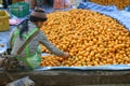 Young girl selling oranges, Southeast Asia