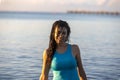 Young girl with sexy smile in the water of the caribbean sea of Mexico's mayan riviera under a warm sunrise. Royalty Free Stock Photo