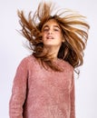 Young Girl shaking her head with hair dishevelled by the wind