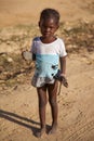 Young girl with a shoes in her hands in Mopti