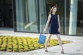 Young girl with shopping bag on the street. Royalty Free Stock Photo