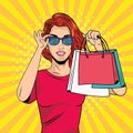 Young girl with shopping bag and sunglasses pop art style