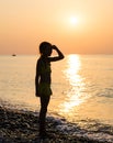 Young girl on shore sea Royalty Free Stock Photo