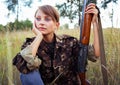 Young girl with a shotgun in an outdoor Royalty Free Stock Photo