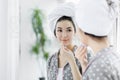 Pretty young brunette woman after shower wearing pajamas Royalty Free Stock Photo