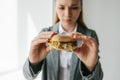 A young girl shows that she does not like a burger. Conceptual image of refusal from unhealthy eating. Royalty Free Stock Photo