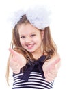 A young girl shows her finger to the side