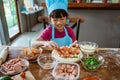 Young girl shows a pizza on the table Royalty Free Stock Photo