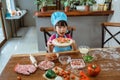 Young girl shows a pizza on the table Royalty Free Stock Photo