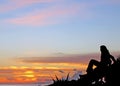 Young girl gazing the sunset beach