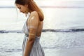 Young girl with silver tattoo and boho jewelry on sunset