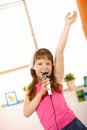 Young girl singing with hand up high Royalty Free Stock Photo