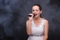 The young girl singing in karaoke club Royalty Free Stock Photo